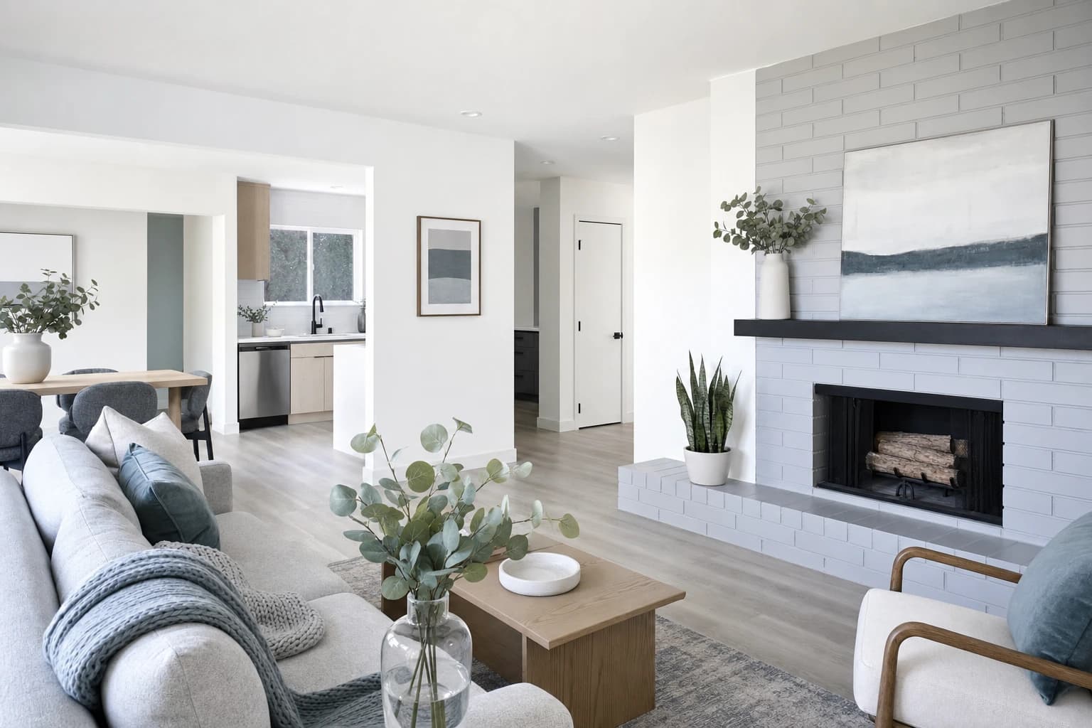 Mid-century ranch interior with painted brick fireplace and LVP floors, Sacramento home remodel